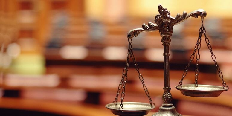 bronze copper scales sitting on a desk