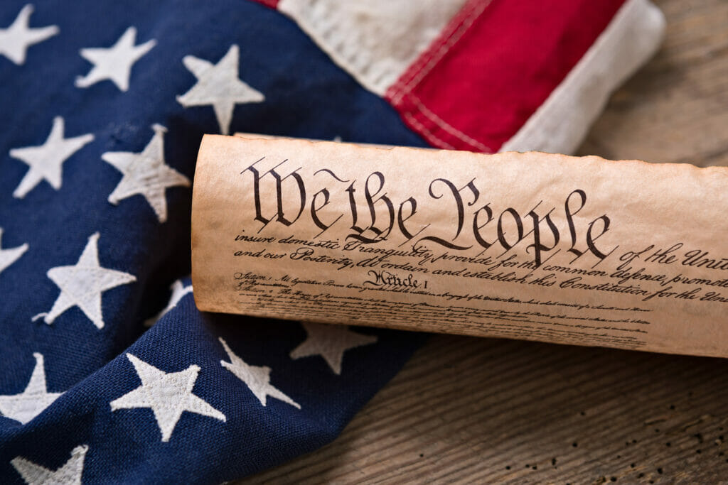 we the people constitution scroll with american flag